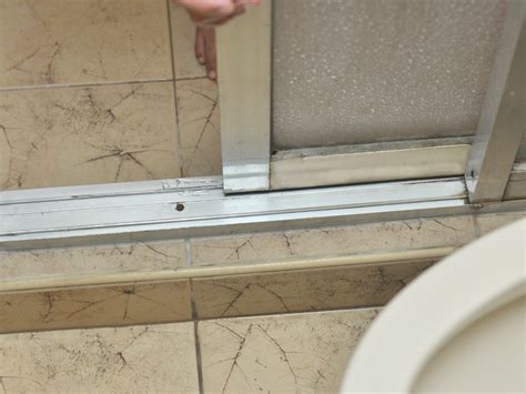 sliding shower door leaks at bottom|How to Fix a Leaking Glass Shower Door 